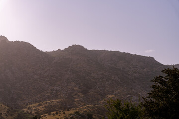 The mountains are covered in rocks and trees