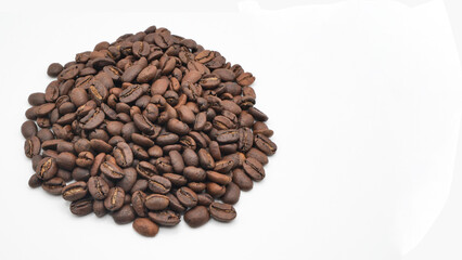 Pile of coffee beans on a white background