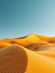 Golden sand dunes under a clear blue sky, showcasing the beauty and serenity of the desert landscape with its rippled textures.