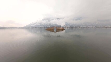 An Aerial FPV Drone Shot of Oont kadal in Dal Lake at Srinagar,Kashmir in India
