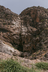 A mountain with a large hole in the middle