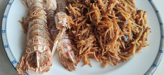 noodles seafood dish known as fideua with crayfish