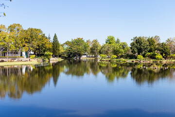 Public park with beautiful reflection on the lake in northern Thailand, summer outdoor day light