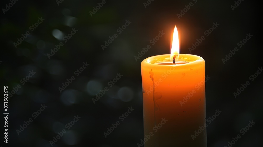 Poster a single candle burning in the dark, casting a warm glow and symbolizing illumination in a minimal e