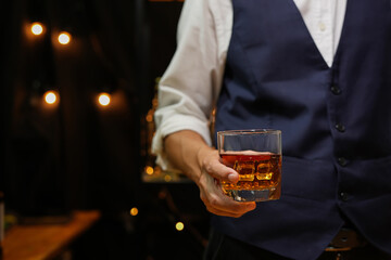 businessmen holding a glass of whiskey