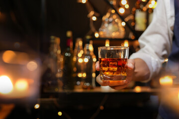 Bartender pouring Whiskey, on  bar