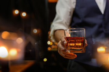Bartender pouring Whiskey, on  bar