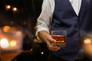 Bartender pouring Whiskey, on  bar