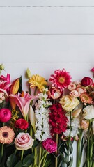 The different flowers on white wooden background