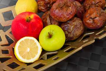 Top view of many colorful fresh ripe fruits is lemon with apple and passion fruit in a golden...