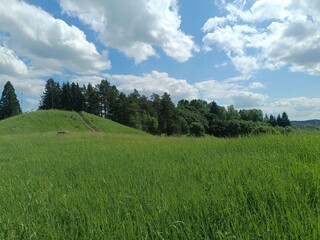 Bubiai hill during sunny day. Small hill. Grass is growing on hill. Staircase leading to the top....