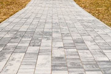 paving path made of gray decorative tiles