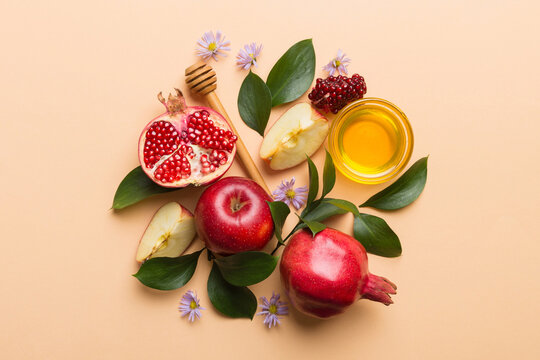 Flat lay composition with symbols jewish Rosh Hashanah holiday attributes on colored background, Rosh hashanah concept. New Year holiday Traditional. Top view with copy space