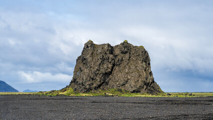 Landsccape on south iceland in summer, a big basalt rock in the middle of nowhere