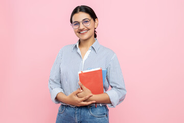 Cheerful delighted girl in casual shirt holding organizer with her notes