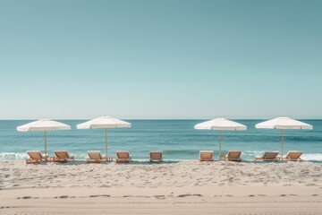 A beach scene with a row of white umbrellas and chairs
