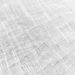 Obraz premium A white fabric with a pattern of white lines. The fabric is very thin and has a very light color
