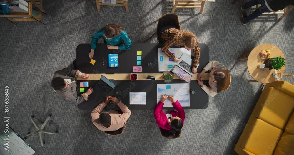 Poster top down zoom out shot: diverse team collaborates on digital marketing strategies. businesspeople an