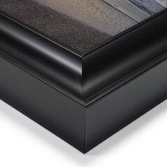 A close up of an art picture frame moulding on a white isolated background