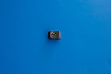 Escape key on a light blue background, shutdown, only way out, one solution, no options