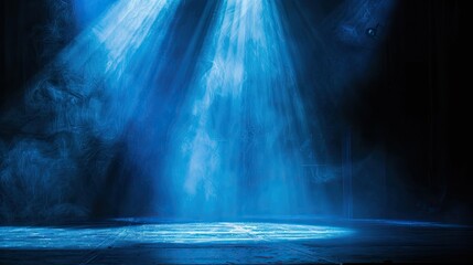 Blue spotlight on dark stage, creating a mesmerizing light contrast