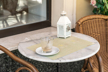 Street Restaurant Table with Dirty Latte Glass, Empty Coffee Cap, Finished Cappuccino, Empty Cup
