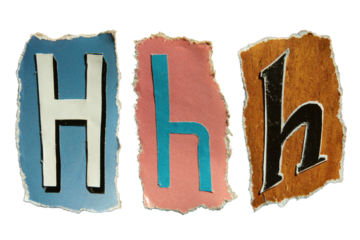 H alphabet torn from a magazine paper. Ransom note style letters.
