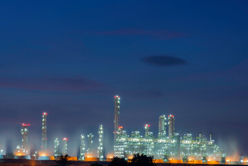 Gas turbine electrical power plant at dusk with orange sky