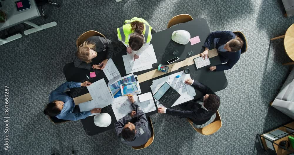 Leinwandbilder top down view of diverse team of real estate construction engineers working with blueprints and docu