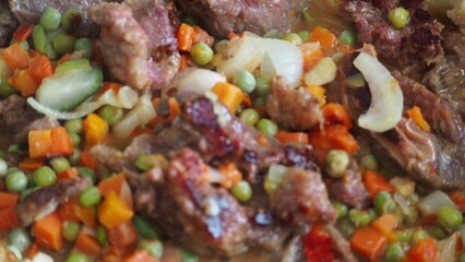 Stir-fry meat and vegetables in an iron skillet. wok stir fry with selective focus