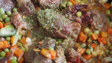 Stir-fry meat and vegetables in an iron skillet. wok stir fry with selective focus