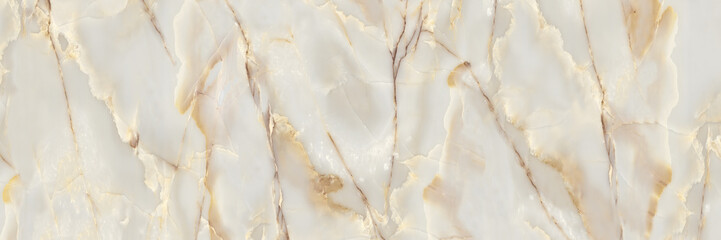 The marble surface is delicately intersected by intricate veins of gold and beige