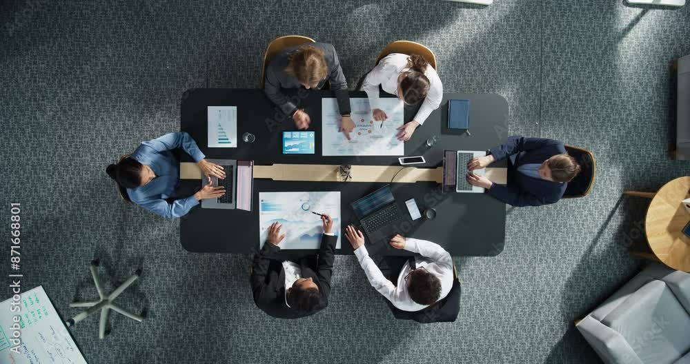 Leinwandbilder diverse professionals working on business statistics reports and marketing plans in an office. top d