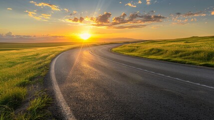 Naklejka premium Landscape of A Road on a Grassland with Sunset View