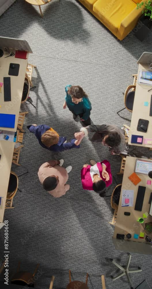 Aufkleber Vertical Screen: Top Down View of Diverse Team Stacking Hands in Office, Symbolizing Unity and Teamwork. Managers And Specialists Celebrating A Successful Month Of Sales, Revenue Growth. Slow Motion