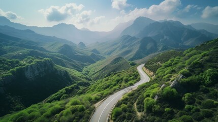 A winding road cuts through the mountain range in an aerial view, Long winding roads with picturesque mountain ranges in the background, AI Generated