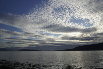 Beautiful sky over the fjords in Norway. Summer. June. Time for white nights. HDR light.