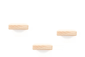 showcase for three items: three wooden shelves over white