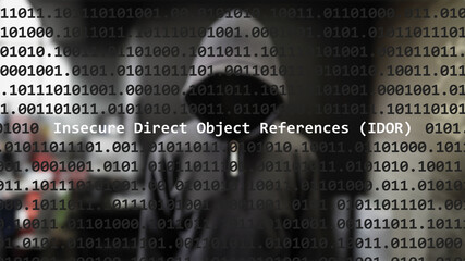 Cyber attack insecure direct object references (idor) text in foreground screen, anonymous hacker hidden with hoodie in the blurred background. Vulnerability text in binary code on editor program.