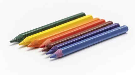 Fototapeta premium Six crayons in various colors on white paper for school tasks