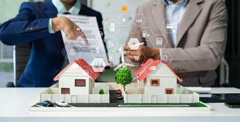balancing the property sector The real estate agent is explaining the house style to see the house...