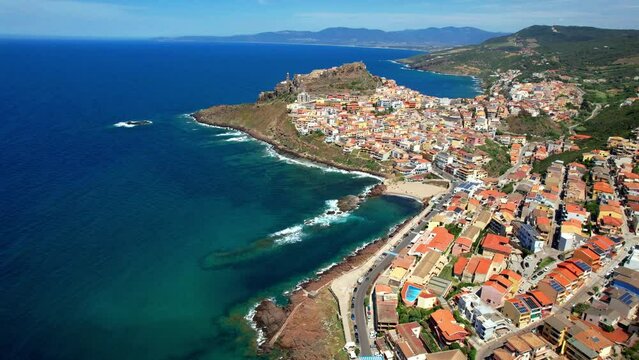 Italy Sardinia cinematic 4K Aerial Drone Video of Castelsardo Scenic Medieval Coastal Town in Sassari with Orange Roofs and Turquoise Sea Bays Mediterranean Architecture Travel