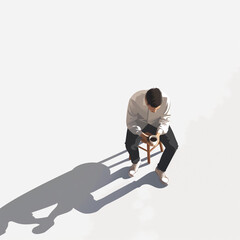 man sitting on a chair, A man sitting and drinking coffee in a cafeteria, with a simple cafe background.