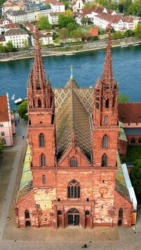 Aerial, drone view of the Basler Munster Cathedral in Basel, Switzerland. Vertical