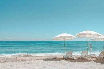 Fototapeta premium A beach scene with two white umbrellas and two white chairs