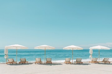 Obraz premium A beach scene with a row of white umbrellas and chairs