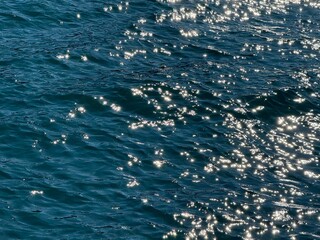 Blue sea  with sun glare on waves 