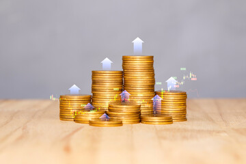 Fund concept. gold coins laid out in a graph on wood floor. Saving money for future and retirement....