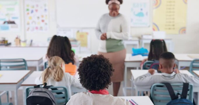 Back, student and raised hand for answer in classroom with question, knowledge and learning in education. Children, diversity group and curious at school with study, solution and feedback for exam