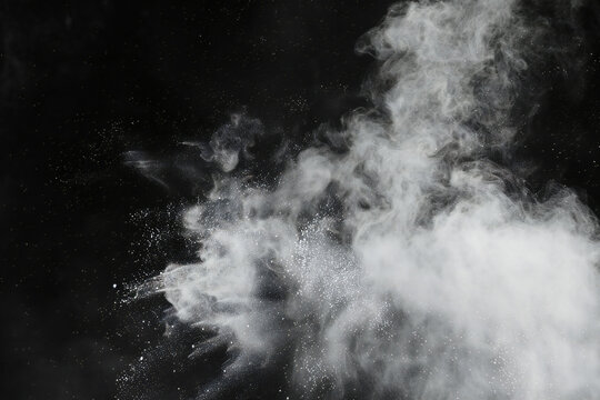 falling debris with dust on black background